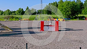 Bordercollie dog in agility training jumping over a fence and going through a tunnel