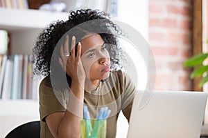 Bored African American businesswoman disinterested in routine work