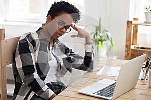 Bored african american woman tired from computer work or study