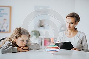 Bored boy during therapy