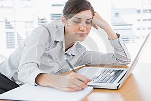 Bored businesswoman at her desk