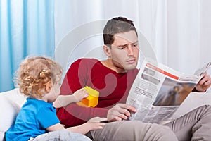 Bored child looking at father