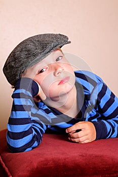 Bored Child Wearing Flat Cap