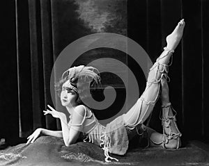 Bored dancer posing in beaded costume