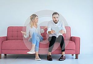 Bored and disregard couple lover sitting on sofa in living room at house together,Family issues photo