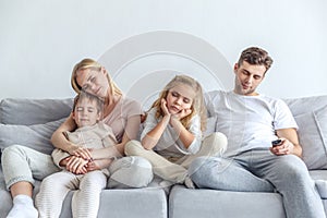 bored family fell a sleep while watching movie at home