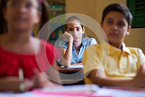 Bored Female Student Latina Girl In Class At School