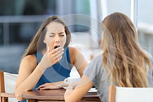 Bored friend having a conversation outdoors