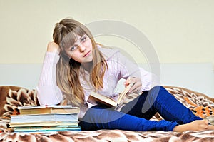 Bored girl with books