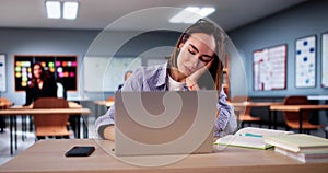 Bored Girl In Classroom Using Computer Technology