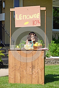 Bored girl at lemonade stand