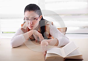 Bored girl stopped reading book