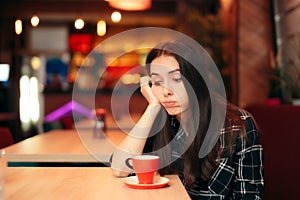 Bored Girl Waiting for her Date in a Coffee Shop