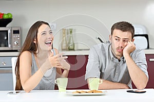 Bored husband hearing his wife talking photo