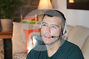 Bored looking man using headset