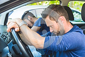 A bored man in the car stuck in the traffic