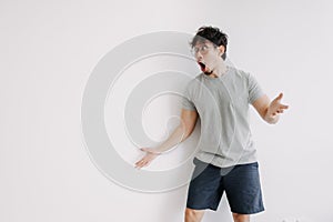 Bored man feel shocked and surprised isolated on white.