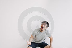 Bored man feel shocked and surprised isolated on white.