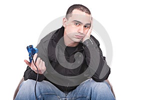 Bored man with a joystick for game console