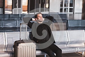 Bored man waiting for his delayed flight