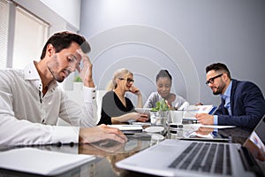 Bored Manager Sitting At Presentation In Meeting