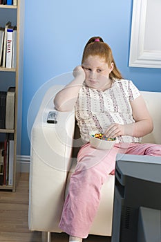 Bored Obese Girl Watching Television