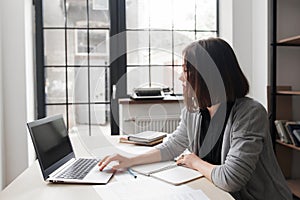 Bored office worker staring at laptop screen