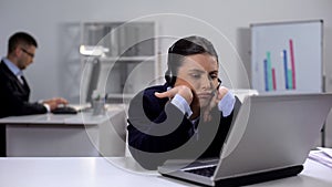 Bored operator in headset at workplace waiting for customer call, telemarketing