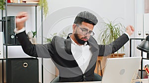 Bored sleepy business man worker working on laptop computer, yawning, falling asleep at home office