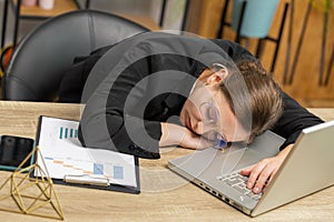 Bored sleepy business woman worker working on laptop computer, yawning falling asleep at home office
