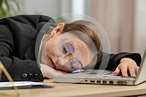 Bored sleepy business woman worker working on laptop computer, yawning falling asleep at home office