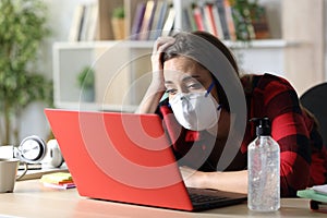 Bored student looking laptop in confinement