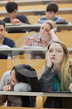 Bored students sitting in a lecture hall