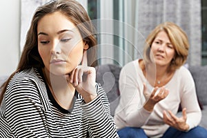 Bored Teenage Girl Being Told Off By Mother