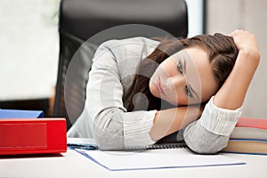 Bored and tired woman behid the table