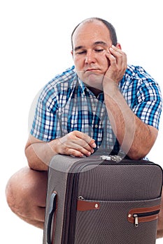 Bored traveller man with luggage