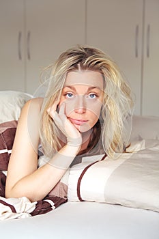 Bored woman confined to her bed