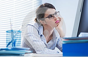 Bored woman at office photo