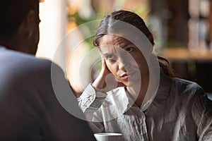 Bored woman sitting on speed dating with boring male