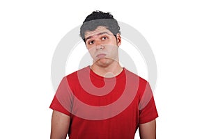 Bored young man making funny face