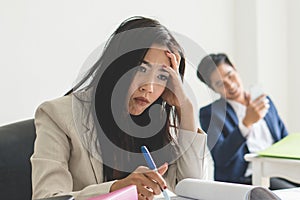 Boredom office work. Asian employee feeling bored her job at workplace and want to change the job photo