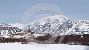 Borg Church between snow covered mountains on the Lofoten in winter