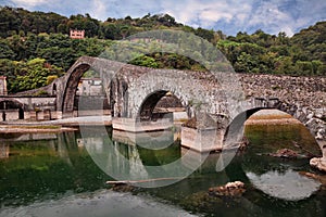 Borgo a Mozzano, Lucca, Tuscany, Italy: the medieval Ponte della Maddalena, known as Bridge of the Devil, which crosses the