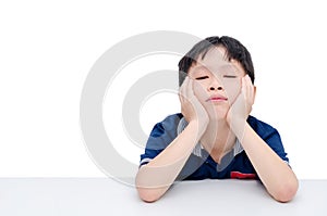 Boring boy sitting over white