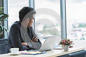 Boring business man with computer in office