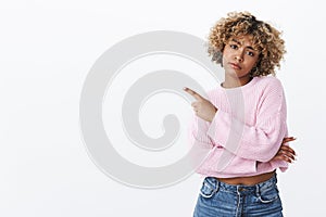 Boring, so out of style. Disappointed gloomy and upset cute african-american cool girl with pierced nose and blond afro