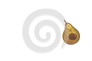 Boring trace of a codling moth Cydia Pomonella, in a wormy pear. On white background