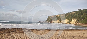 Boriquen Beach Aguadilla Puerto rico surf on sand on a sunny day photo