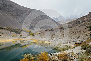 Borith lake against Karakoram mountain range. Autumn season in Gilgit Baltistan, Pakistan.