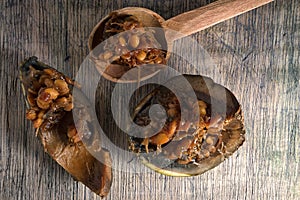 Borojo fruit on wood background